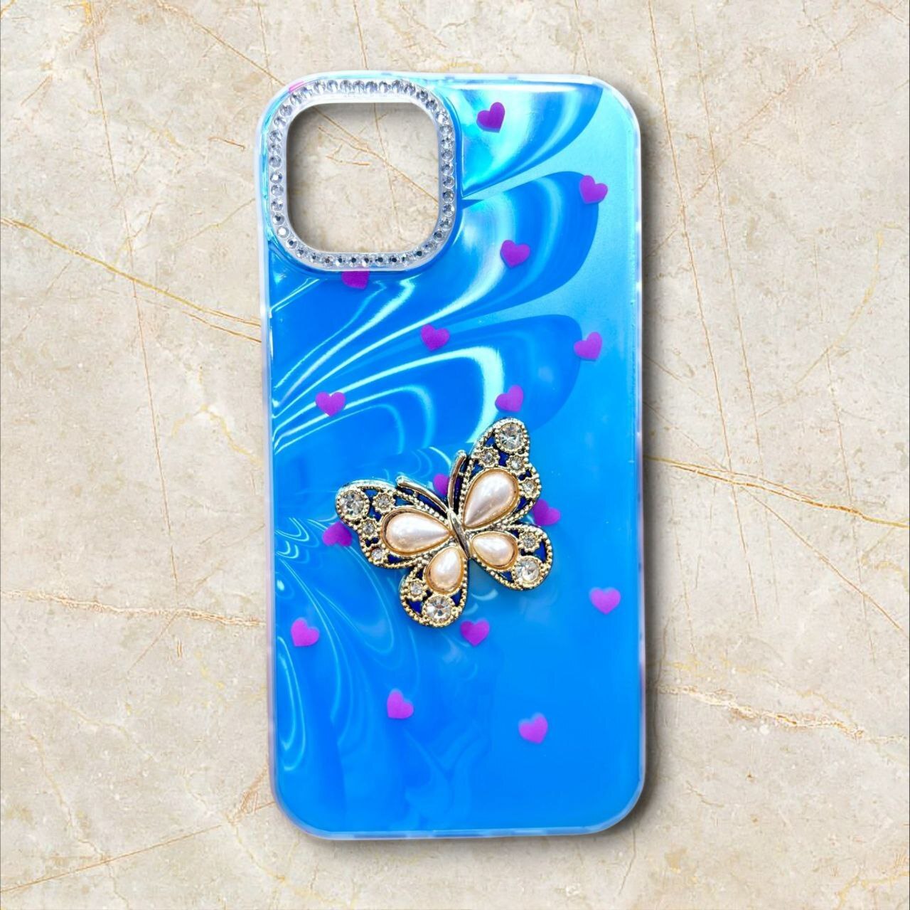  قاب پروانه نگینی آیفون iPhone16ProMax رنگ آبی روشن – Butterfly Crystal – یونیک کیس 