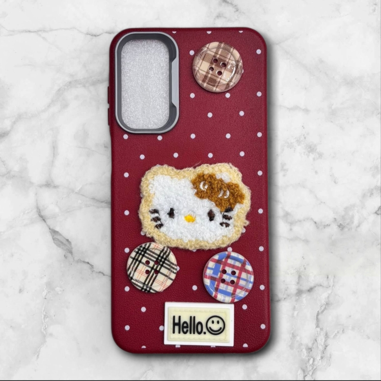 قاب طرح دار سامسونگsamsunga15 هلوکیتی دخترانه با دکمه‌های فانتزی رنگ قرمز – یونیک کیس 